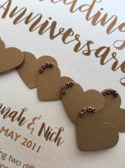 each heart is adorned with tiny metallic beads