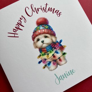 Cute puppy wearing a santa hat and tangled in the Christmas lights features on a personalised Christmas card